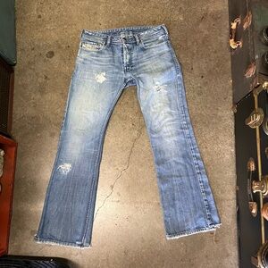 Diesel Industry denim division ripped jeans with embellishments